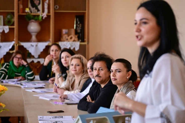 Sorina Stoianova (R) teaches a Romanian language lesson in Gagauzia, Moldova