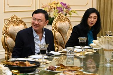 Former Thai prime minister Thaksin Shinawatra (L) was seen visiting a shrine in Bangkok by an AFP journalist on Thursday