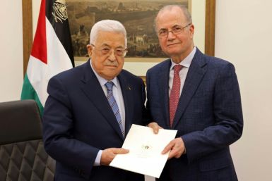 Palestinian president Mahmud Abbas (L) presents his new prime minister, Mohammed Mustafa, a long-trusted adviser on economic affairs, at the Palestinian Authority's headquarters in Ramallah