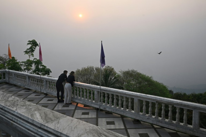 Thai tourist hotspot Chiang Mai was blanketed by hazy smog Friday, as residents and visitors to the usually picturesque northern city were left wheezing in the toxic air