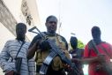 Armed gang leader Jimmy "Barbecue" Cherizier and his men are one of the main gangs in Port-au-Prince, Haiti