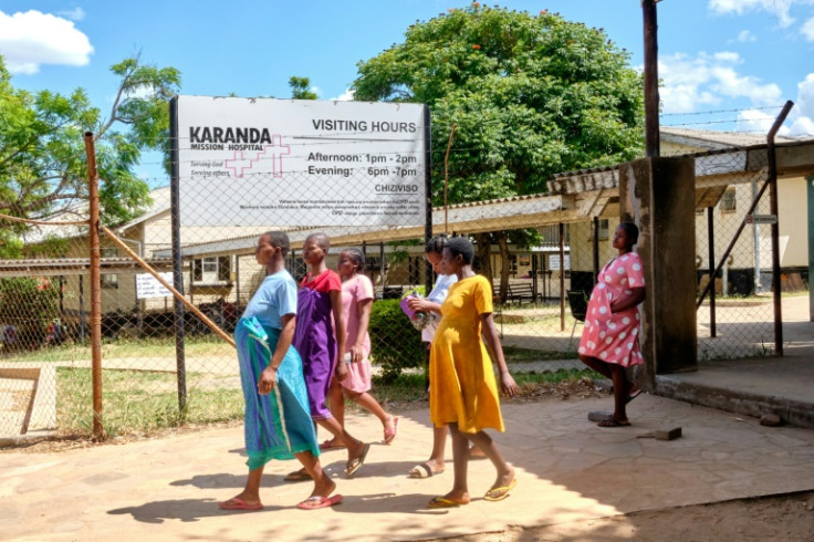 Pregnant women take a walk outside the maternity ward at Karanda Mission Hospital in Zimbabwe's Mount Darwin