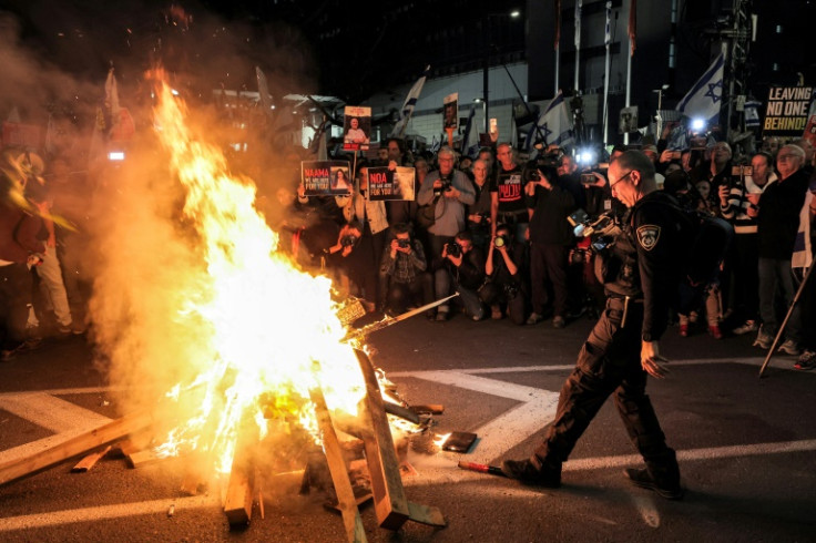 Israeli protesters calling for hostage release block a highway in Tel Aviv during an anti-government rally