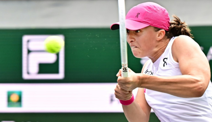 World number one Iga Swiatek hits a backhand on the way to victory over Greece's Maria Sakkari in the women's final of the ATP-WTA Indian Wells Masters