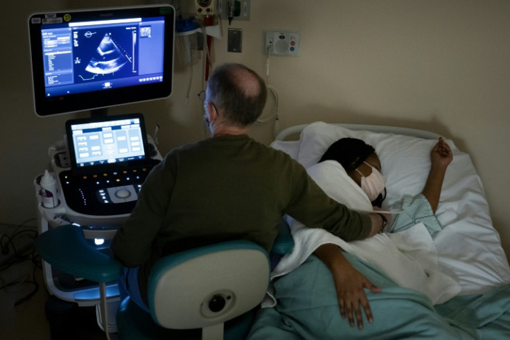 A patient receives an echocardiogram in a followup visit during her clinical trail at the National Institutes of Health