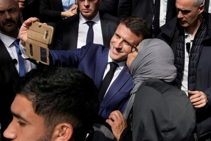 French President Emmanuel Macron met residents in the area which has a large Muslim population
