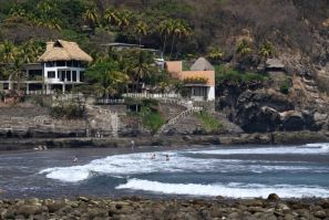 Tourists bathe at the Salvadoran beach town of El Zonte, known as 'Bitcoin Beach' for its embrace of the cryptocurrency