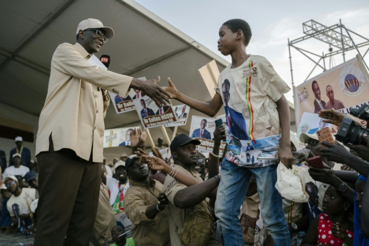 Many people have faith in outgoing President Macky Sall's candidate, Amadou Ba (left), a former prime minister