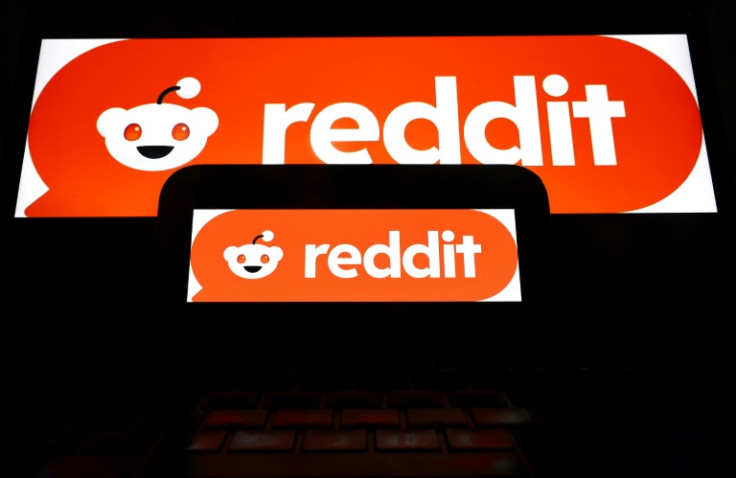 The Reddit logo displayed on a cell phone and computer monitor