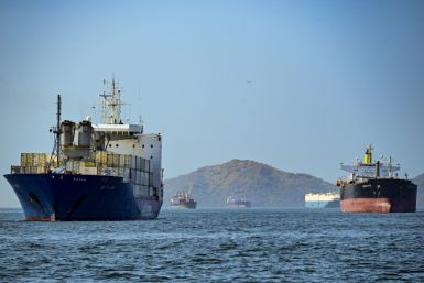 Cargo ships wait to cross the Panama Canal in Panama City