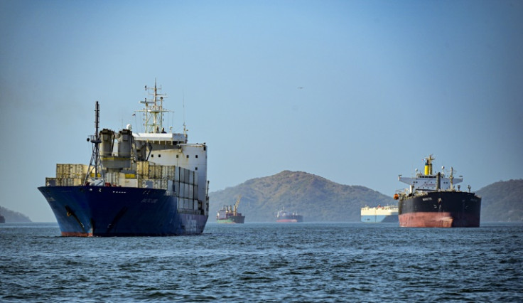 Cargo ships wait to cross the Panama Canal in Panama City