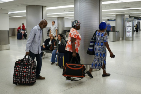 Haitian-American citizens arrive in the Untied States on a charter flight from Cap-Haitien to Miami International Airport in Miami, Florida, on March 21, 2024