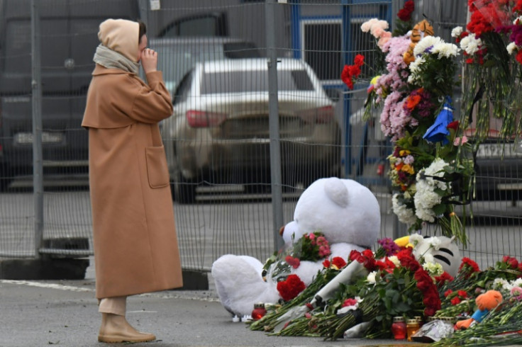 Russians left flowers and toys in tribute outside the Crocus City Hall, a day after a gun attack in which at least 133 people were killed