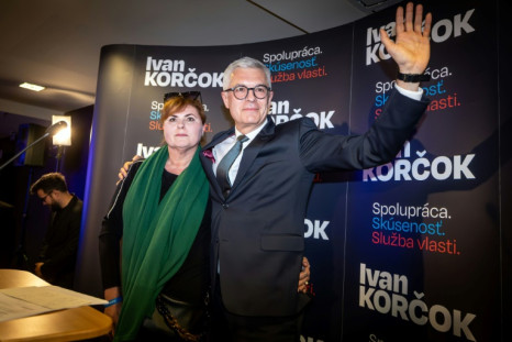 Ivan Korcok with his wife, Sona Korcokova, during the first round of Slovakia's vote on Saturday