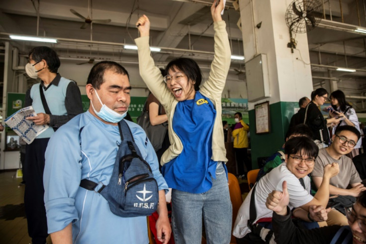 Xu, a student from mainland China, celebrates picking a winner at one of Macau's final race meetings on Sunday, March 17. "We don't have these races (in China)... It's different watching it live," she says