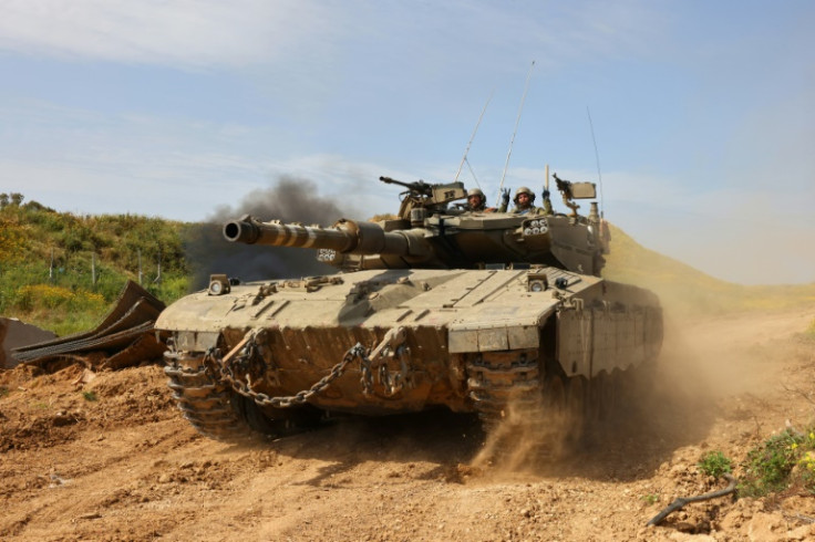 An Israeli tank moving along the border with the Gaza Strip