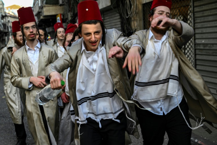 Ultra-Orthodox Jewish youths celebrate Purim in Jerusalem's Mea Sharim district