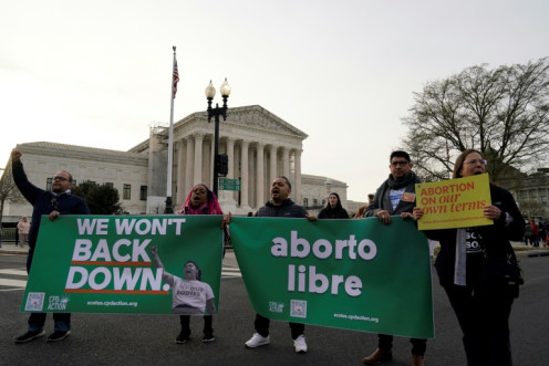 Abortion rights activist rally in front of the US Supreme Court as it hears arguments on access to the abortion pill mifepristone