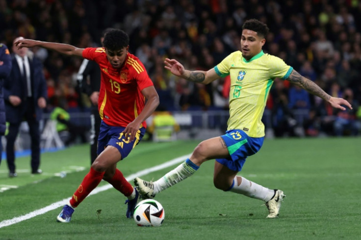 Spain forward Lamine Yamal (L) thrilled in the 3-3 draw with Brazil at the Santiago Bernabeu on Tuesday