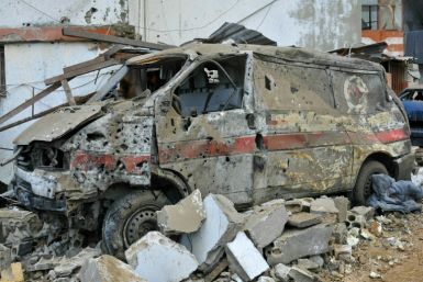 A damaged ambulance is seen outside the compound in the south Lebanon village of Habariyeh where seven people were reported killed by a pre-dawn Israeli air strike