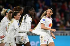 Delphine Cascarino (R) celebrates with team-mates after scoring Lyon's second goal against Benfica