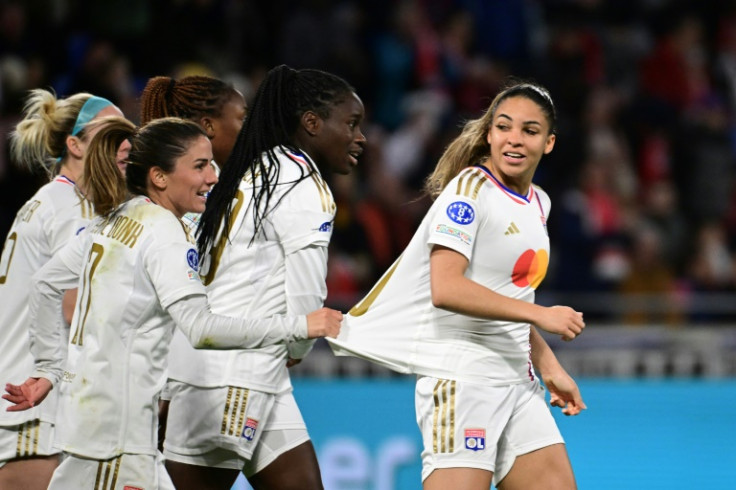 Delphine Cascarino (R) celebrates with team-mates after scoring Lyon's second goal against Benfica