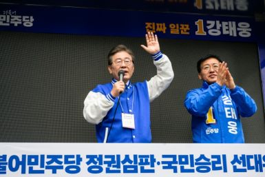 South Korea's main opposition Democratic Party leader Lee Jae-myung (L) speaks to supporters in Seoul on March 28, 2024