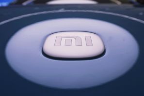 Xiaomi's logo featured on its new SU7 EV model at a shop in Hangzhou