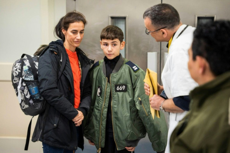 Eitan Yahalomi (R) was reunited with his mother after 52 days in captivity