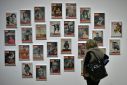 A woman looks at LIFE magazine copies as part of the show "Sorprendeme!", a retrospective of Philippe Halsman at CaixaForum in Madrid, November 30, 2016
