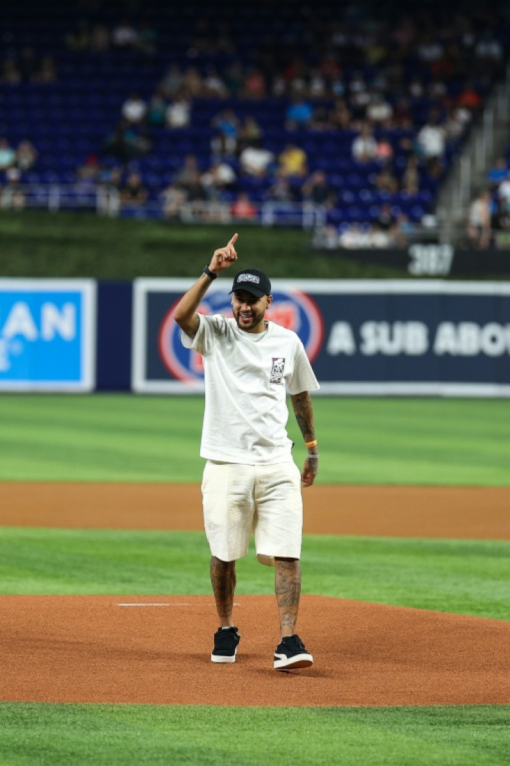 Brazilian footballer Neymar throws the ceremonial first pitch at the Miami Marlins MLB home opener against the Pittsburgh Pirates