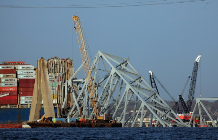 Cranes work to clear debris from the Francis Scott Key Bridge on March 29, 2024 in Baltimore, Maryland