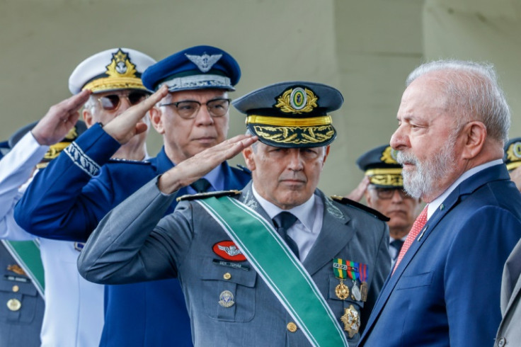 Brazil's President Luiz Inacio Lula da Silva (R) receiving salutes from the Armed Forces Chiefs