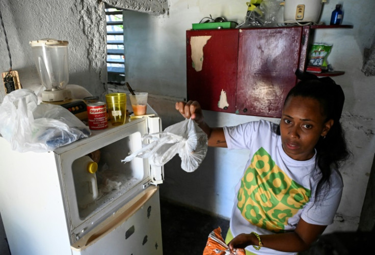 Diana Ruiz and her nearly empty refrigerator, photographed in Havana on March 27, 2024