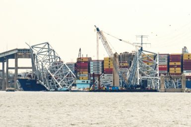 The container ship Dali is seen pinned under fallen wreckage of the Francis Scott Key Bridge in Baltimore, Maryland on March 30, 2024