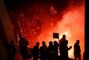 Demonstrators blocked a main city highway, lighting fires and waving Israeli flags