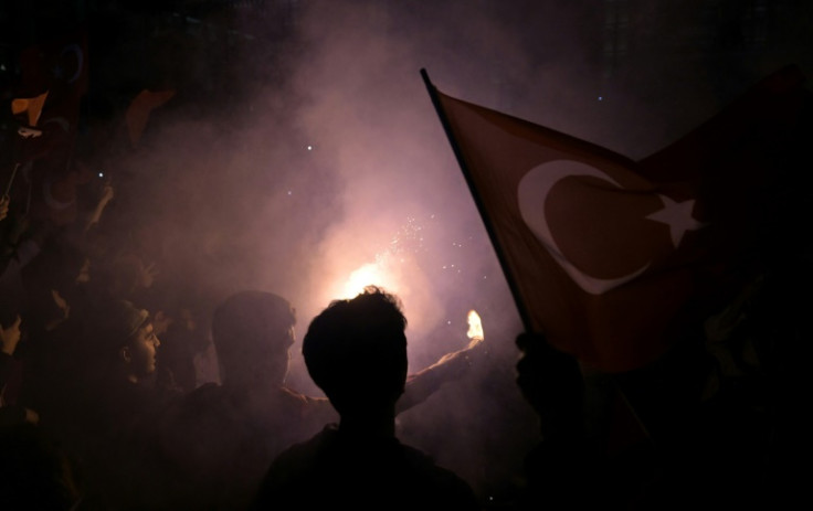 Opposition supporters in Istanbul celebrated with flags and flares overnight