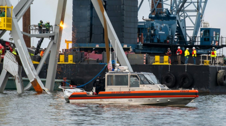 US authorities hope to create a temporary channel while they remove the wreckage of Baltimore's Francis Scott Key Bridge, seen here in this handout photo from the Coast Guard