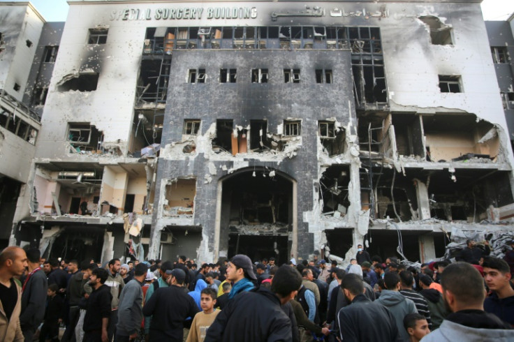 Palestinians gathered to inspect the damage to Gaza's Al-Shifa hospital after the Israeli military withdrew following a two-week battle