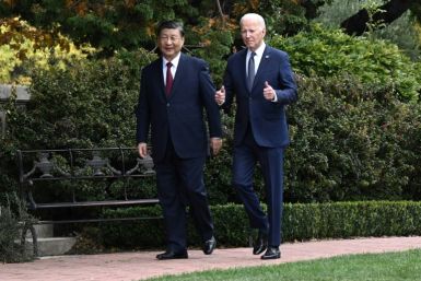 US President Joe Biden and Chinese President Xi Jinping walk together after a meeting in Woodside, California on November 15, 2023
