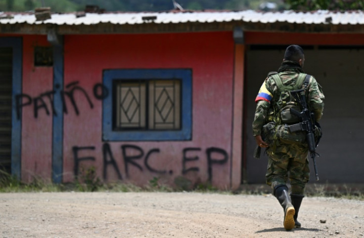 A member of the Carlos Patino front of the dissident FARC guerrilla patrols in Micay Canyon, a mountainous area and EMC stronghold in southwestern Colombia
