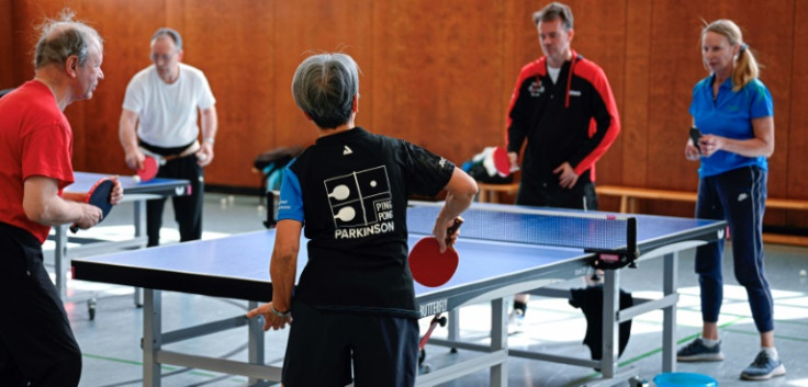 People play table tennis at the Ping Pong Parkinson initiative in Berlin on April 11, 2023, World Parkinson's Day -- the devastating disorder affects 10 million people worldwide