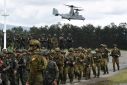 Philippine and Australian soldiers march in formation during the 2023 military exercise Alon, a joint amphibious landing drill