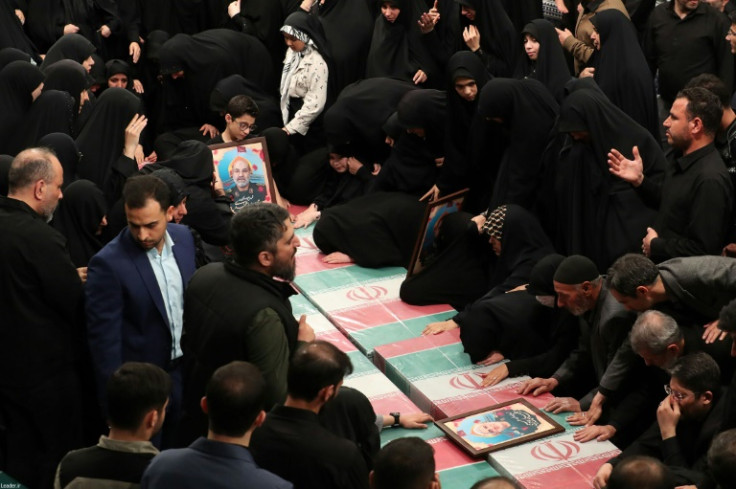 Relatives in Iran mourn over the coffins of seven Revolutionary Guard Corps members killed in a strike on the country's consular annex in Damascus, which Tehran blamed on Israel