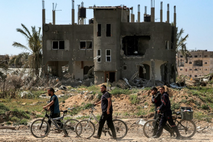 After troops left areas in and around the largely destroyed city of Khan Yunis, a stream of displaced Palestinians walked there