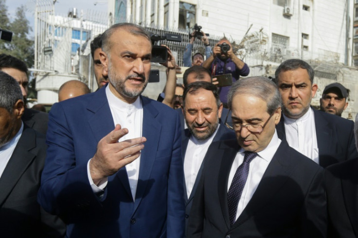 Iran's Foreign Minister Hossein Amir-Abdollahian (L) with his Syrian counterpart Faisal Mekdad (R) on the site of the new consular section