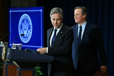 US Secretary of State Antony Blinken and British Foreign Secretary David Cameron depart at the end of a joint press conference at the State Department