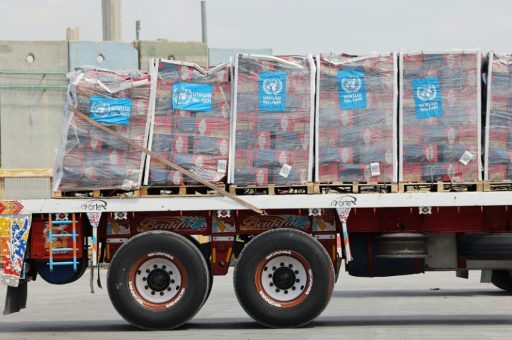 A truck carrying humanitarian aid slated for Gaza awaits clearance at an Israeli crossing
