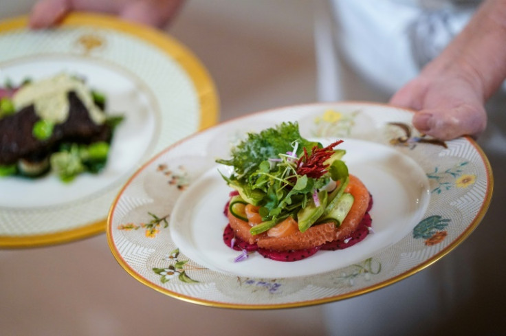 The first course dish of House-cured Salmon, avocados, red Grapefruit, watermelon radish, cucumber shisho leaf fritters is displayed during a media preview ahead of the State Dinner for Japan's Prime Minister Fumio Kishida and his spouse Yuko Kishida, at 