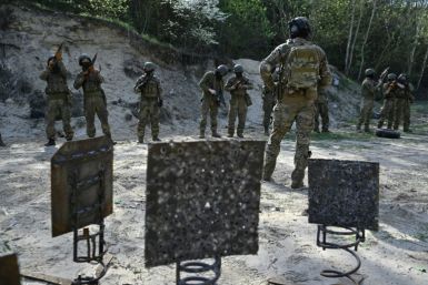 Members of the Siberian battalion within the Ukrainian Armed Forces take part in a military training exercise on a shooting range in the Kyiv region